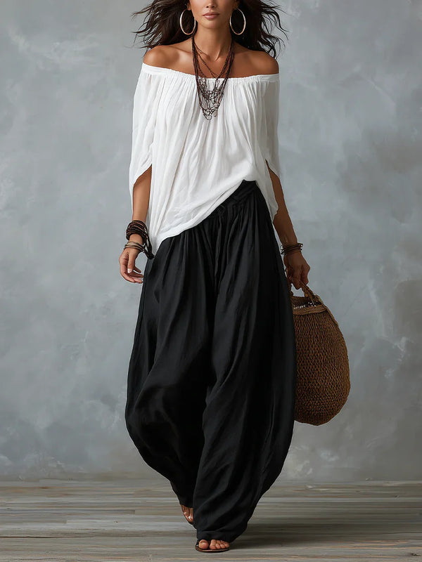 Mara • Conjunto blusa blanca hombros descubiertos y pantalón palazzo negro